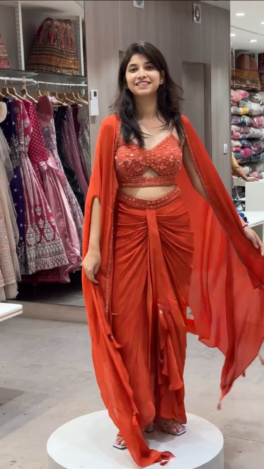 Full view of satin silk dhoti-style outfit with embroidered shrug and choli