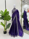 Model showcasing flowy silhouette of embroidered Jimmy Chu saree