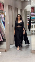 Full view of satin silk dhoti-style outfit with embroidered shrug and choli