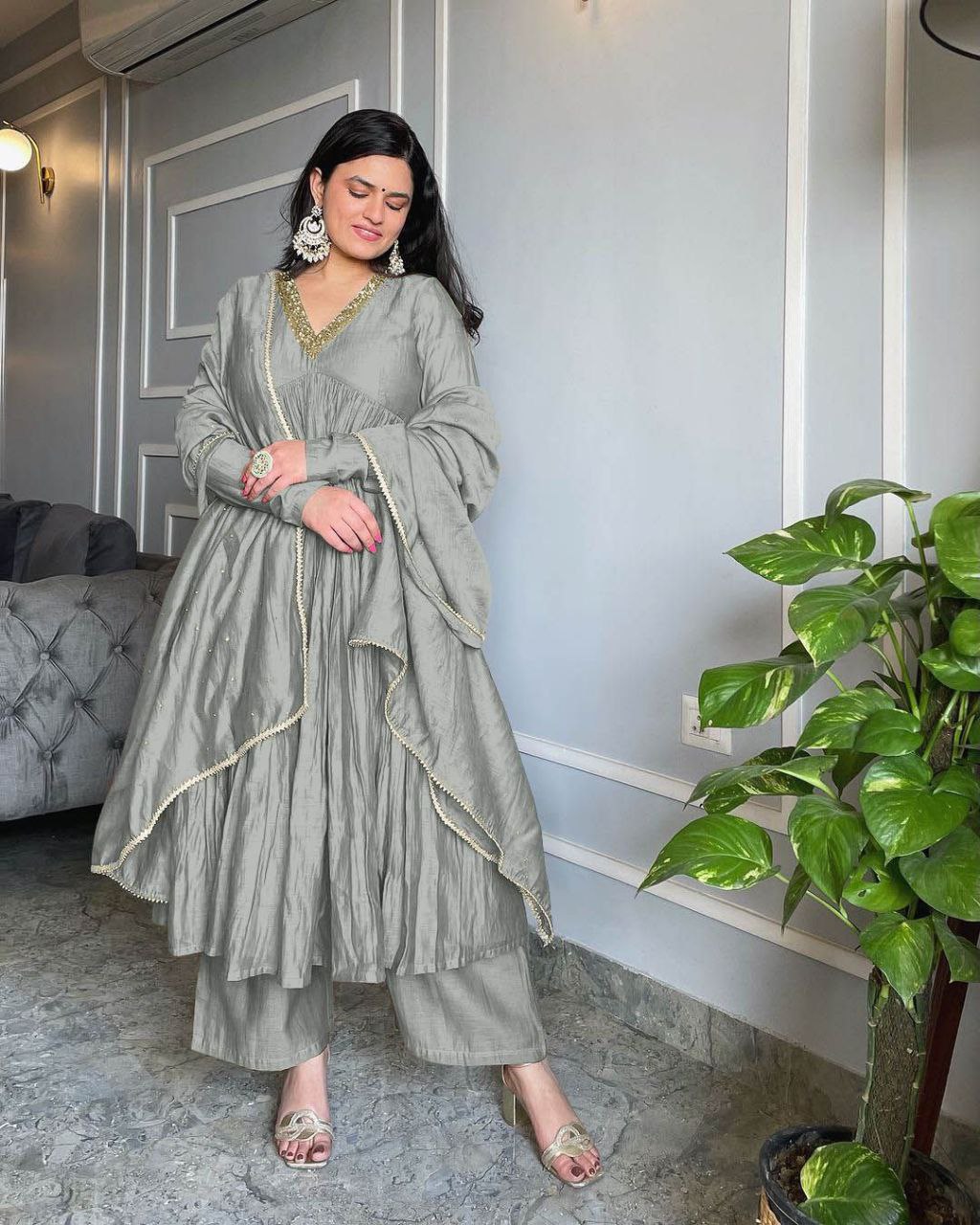Gorgeous Grey Alia Cut gown with a 3-meter flare, full sleeves, and matching plazzo and dupatta.
