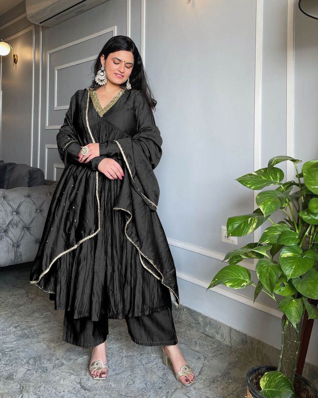 Black Alia Cut Anarkali gown with delicate embroidery and matching plazzo with elastic waistband.
