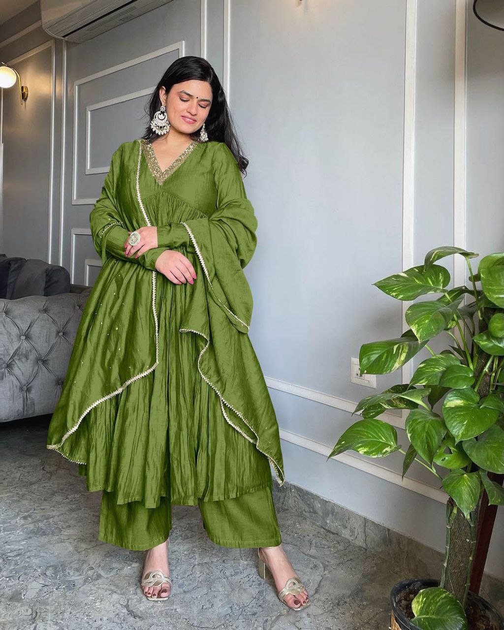 Beautiful Green Anarkali gown in Pur Chinon Silk with embroidered details, perfect for special occasions.
